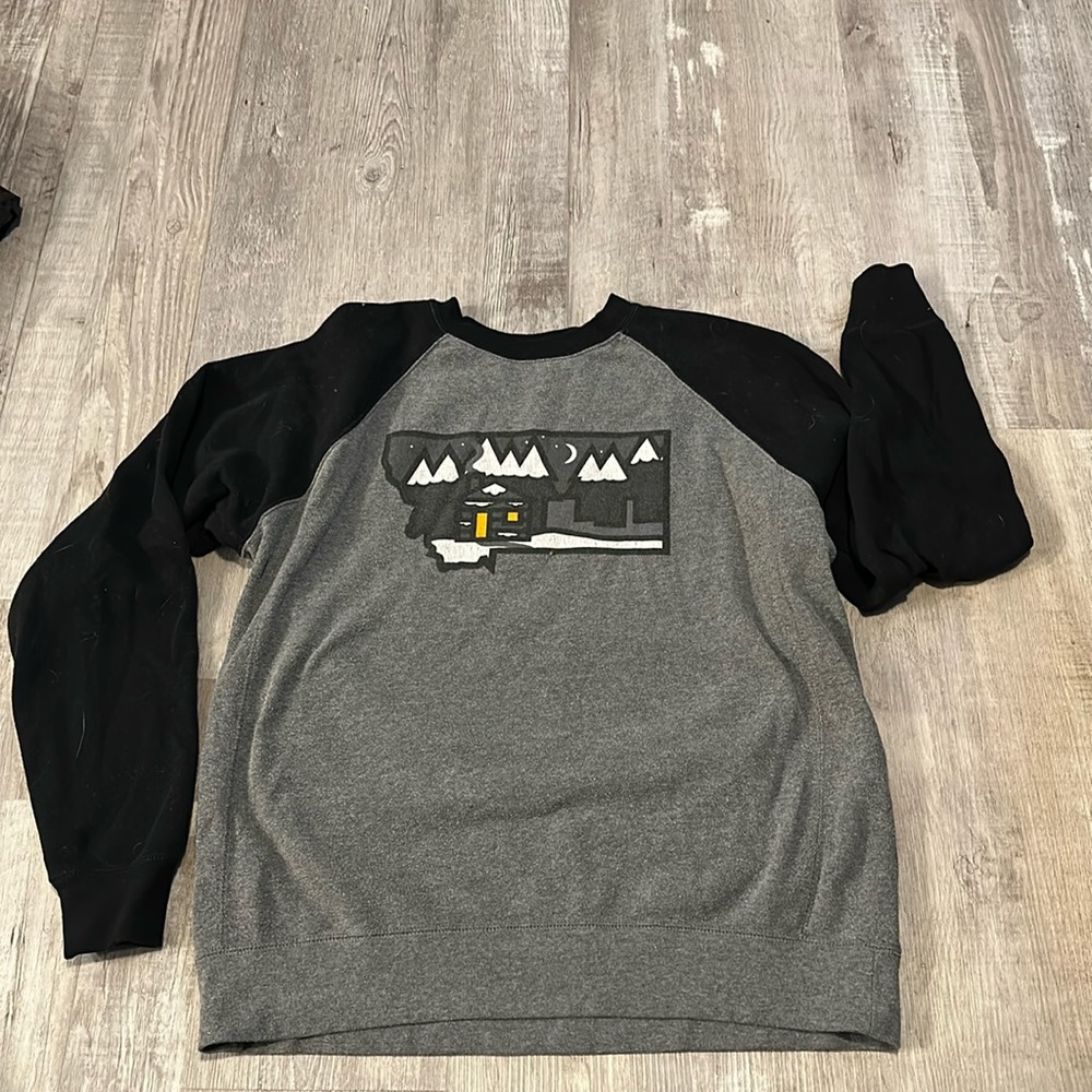 Black and grey crewneck sweatshirt.